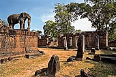 Angkor - Eastern Mebon - monolithic elephants at the corners of the platforms of the pyramid